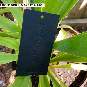 May include: A rectangular black tag with a pre-punched hole at the top. The word STYLESTREAM is embossed vertically in the center. The text ADD A HOLE DRILL, MAKE IT A TAG! is printed in white at the top left corner of the image.