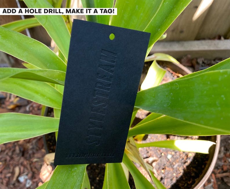 May include: A rectangular black tag with a pre-punched hole at the top. The word STYLESTREAM is embossed vertically in the center. The text ADD A HOLE DRILL, MAKE IT A TAG! is printed in white at the top left corner of the image.