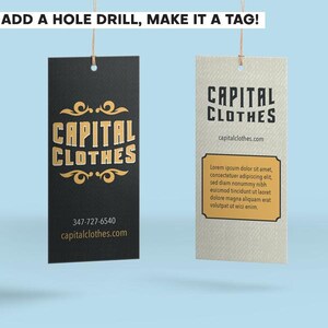 May include: Two rectangular hanging tags with string loops. The left tag is black with gold text reading CAPITAL CLOTHES, a phone number, and website. The right tag is off-white with black text reading CAPITAL CLOTHES and placeholder text.