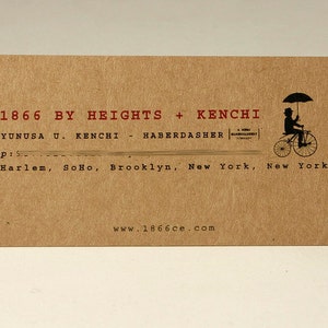 May include: A rectangular tan business card with black and red text. It reads 1866 BY HEIGHTS + KENCHI, YUNUSA U. KENCHI - HABERDASHER, and lists locations including Harlem, SoHo, Brooklyn, New York. A black silhouette of a person on a bicycle with an umbrella is present.