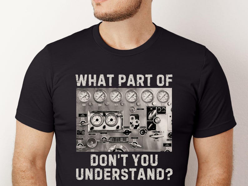 May include: Black t-shirt with a white graphic of a control panel with gauges and the text "WHAT PART OF DON'T YOU UNDERSTAND?"