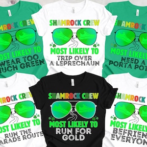 May include: A collection of green, white, and black t-shirts with St. Patrick's Day-themed graphics. Each shirt features the text "Shamrock Crew" and a unique phrase like "Most Likely to Wear Too Much Green" or "Most Likely to Run for Gold."