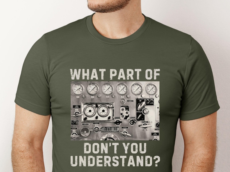 May include: A green t-shirt with a graphic of a control panel with gauges and the text "What part of don't you understand?"