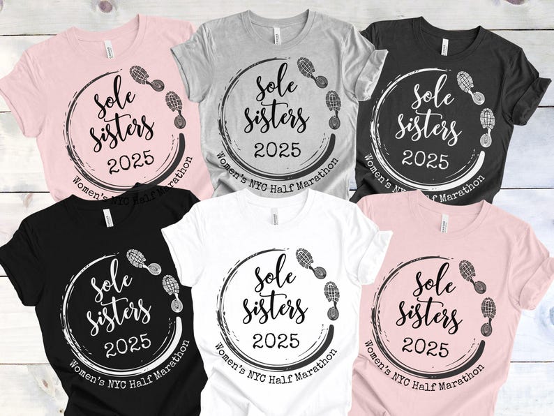 May include: Six t-shirts in different colors with a white circle design that says "Sole Sisters 2025" with footprints around the circle. The text "Women's NYC Half Marathon" is written below the circle.