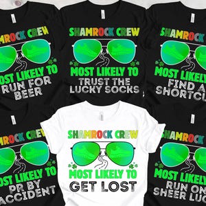 May include: A collection of black and white t-shirts with the text "Shamrock Crew" and various phrases like "Most Likely to Run for Beer" and "Most Likely to Get Lost". Each shirt features a design of green sunglasses with a running shoe inside.