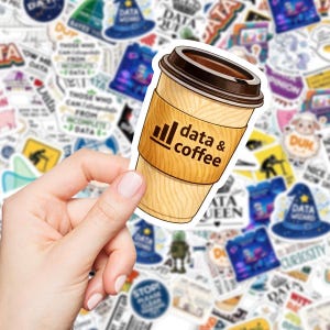 May include: A sticker featuring a coffee cup with the words "data & coffee" printed on the side. The cup is light brown with a dark brown lid. The background is filled with various stickers.
