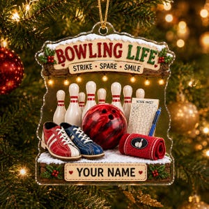 May include: A clear acrylic Christmas ornament featuring a bowling theme with the text BOWLING LIFE, STRIKE, SPARE, SMILE, and YOUR NAME. It displays white bowling pins, a red and black bowling ball, bowling shoes, a score sheet, and a red towel.