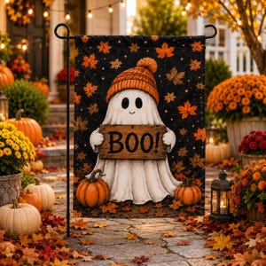 A Halloween-themed banner featuring a ghost holding a sign that says "BOO!" surrounded by pumpkins, fall leaves, and other fall decorations.