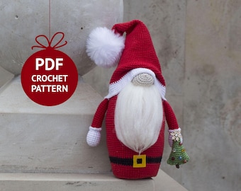 May include: A crocheted Santa gnome holding a small green Christmas tree. The gnome is wearing a red hat with a white pom-pom, a white beard, and a red and white outfit. The gnome is standing on a gray surface. PDF CROCHET PATTERN.