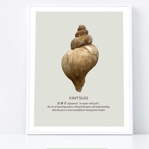May include: A framed print featuring a detailed image of a seashell repaired with gold lacquer, showcasing the Japanese art of Kintsugi. The print includes the word "KINTSUGI" and the phrase "Freya & Bloom".