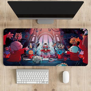 May include: A rectangular mouse mat with a vibrant cartoon illustration of a gothic scene with several characters. The design features a central figure in a red cape, surrounded by other creatures. A computer monitor, keyboard, and mouse are visible.