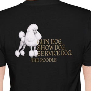 May include: Black t-shirt featuring a white poodle illustration. The design includes the text "GUN DOG. SHOW DOG. SERVICE DOG. THE POODLE." The poodle is depicted in a detailed, realistic style.
