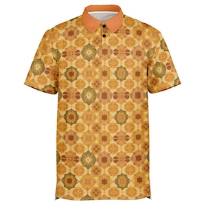 May include: A short-sleeved polo shirt featuring a repeating geometric pattern in shades of mustard yellow, burnt orange, and olive green. The shirt has a solid light orange collar and a placket with two black buttons at the center of the neckline.
