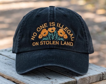 No One Is Illegal on Stolen Land Hat – Floral Embroidered Black Dad Cap, Social Justice Statement Hat with Poppies, Indigenous Rights