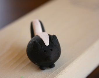 Mr. Skunk Miniature Clay Figurine