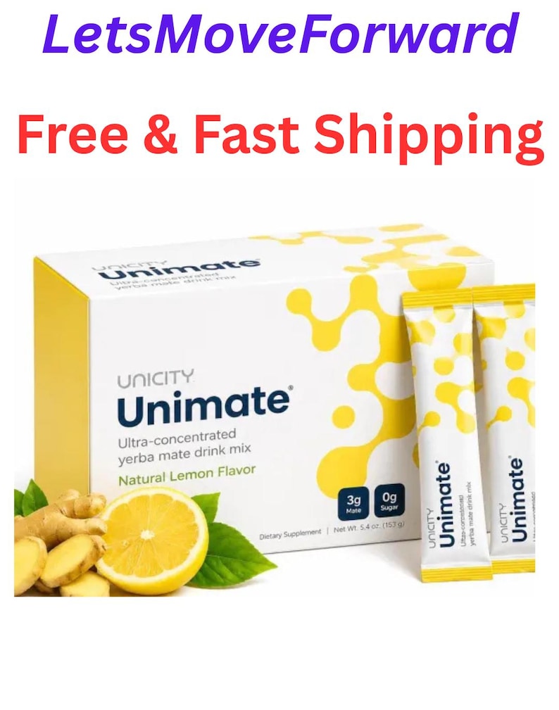 May include: A white and yellow box of Unicity Unimate ultra-concentrated yerba mate drink mix in natural lemon flavor, accompanied by two matching sachets, a sliced lemon, and ginger root, with a net weight of 5.4 oz printed on the box.