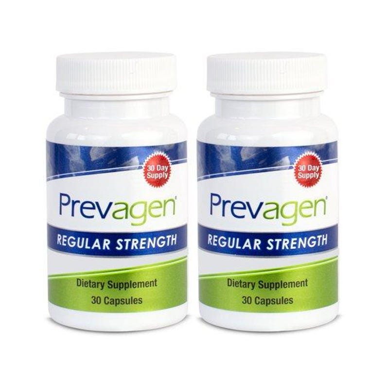 May include: Two white supplement bottles with blue and green labels. The labels read "Prevagen Regular Strength" and "Dietary Supplement 30 Capsules." Each bottle has a "30 Day Supply" sticker. The bottles are on a white background.