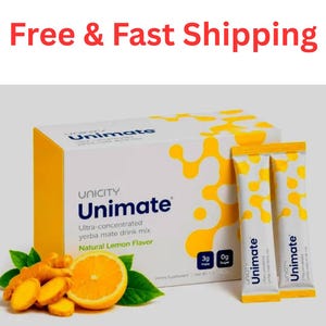 May include: A white rectangular box of Unicity Unimate ultra-concentrated yerba mate drink mix with yellow organic patterns, two matching stick packets, a sliced lemon, and ginger root. The box displays text including Unimate and Natural Lemon Flavor.