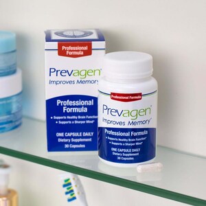 May include: A white bottle and box of Prevagen dietary supplements. The bottle and box have blue and red accents and the text "Prevagen Improves Memory". The box and bottle state "Professional Formula" and "One Capsule Daily". A single capsule is visible.