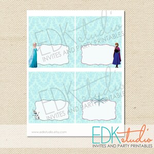 May include: Four printable place cards featuring characters from the movie Frozen. The cards are on a light blue background with a white damask pattern. The top left card features Elsa, the top right card features Anna, the bottom left card features Olaf, and the bottom right card features a snowflake.