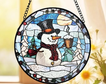 星とクリスマスツリーが描かれた雪景色のコテージのステンドグラス