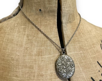 antique late 19c good sized locket in white metal with forget me not flower detail on silver chain