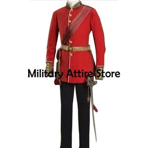 May include: A red military-style tunic with gold buttons, a high collar, and a gold waist belt, paired with black trousers. A decorative sash crosses the chest, and a sword hangs at the hip. The text Military Attire Store is visible.