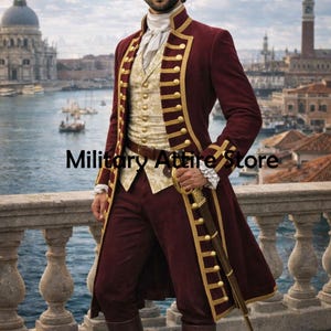 May include: Burgundy-colored military-style coat with gold trim and buttons. The coat is paired with a cream-colored vest and burgundy pants. The image includes the text "Military Attire Store".