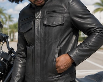 May include: A black leather jacket featuring a mandarin collar, a full-length front zipper, two chest pockets with flaps, and two zippered side pockets. The jacket has vertical seam detailing along the front and long sleeves with cuffs.