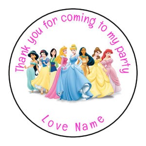 May include: Round sticker with a pink border and white background. It features a group of Disney princesses, including Cinderella, Snow White, Ariel, Belle, and more. The text reads "Thank you for coming to my party Love Name".