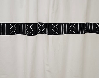 White cotton shower curtain accented with African print mudcloth