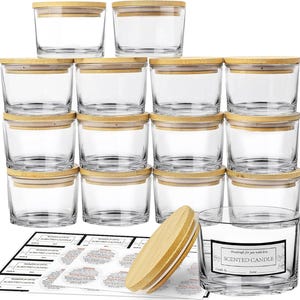 May include: A set of clear glass jars with bamboo lids, stacked neatly. The jars are cylindrical and have a minimalist design. Included are labels for scented candles, and a single candle jar with a label that reads "Scented Candle".