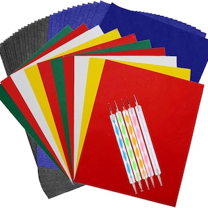 May include: A craft kit featuring assorted colored paper sheets in red, yellow, green, white, and blue, along with a set of five double-ended dotting tools. The paper is arranged in a fan shape, showcasing the variety of colors.