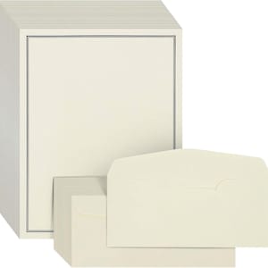 May include: Cream-coloured stationery with a black border, alongside matching envelopes. The stationery has a clean, minimalist design, suitable for various correspondence needs. The envelopes are also cream-coloured.