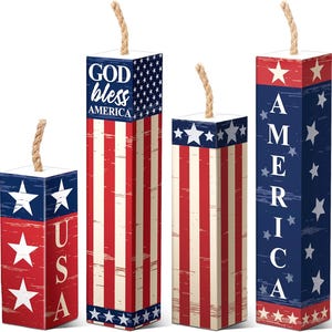 May include: Four rectangular decorative boxes with a patriotic theme. The boxes are red, white, and blue, with star and stripe designs. One box reads "USA", another says "GOD bless AMERICA", and a third says "AMERICA". Each box has a rope-like wick.