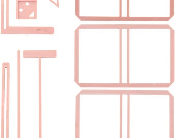 May include: A set of pink plastic craft tools for scrapbooking and card making. The set includes a ruler, a corner tool, a straight edge, and three different sized frames.