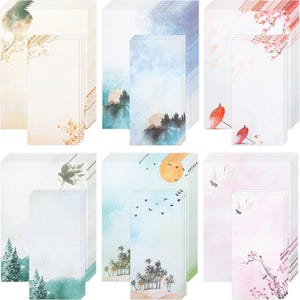 May include: A selection of stationery sets with watercolour designs. Each set includes rectangular notepads and matching long, narrow cards. Designs feature landscapes, birds, and floral elements in various colour palettes, including blue, pink, and green.