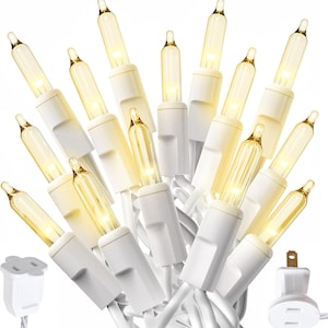 May include: A string of warm white mini Christmas lights with white wire and plugs. The bulbs are clear with a golden glow, and the white bases are evenly spaced along the wire. The plugs are also white.