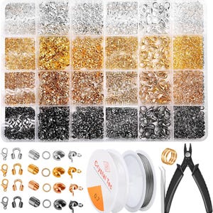 May include: A clear plastic storage box filled with various gold, silver, and black metal jewelry findings. The box includes jump rings, lobster clasps, and other connectors. The box also includes a spool of wire, a pair of pliers, and a tweezers.