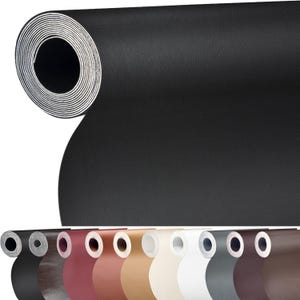 May include: A roll of black faux leather upholstery fabric. The fabric is rolled up and the end of the roll is visible. The fabric is textured and has a slight sheen. The roll is sitting on a white surface. There are 10 smaller rolls of fabric in different colors in the bottom of the image.