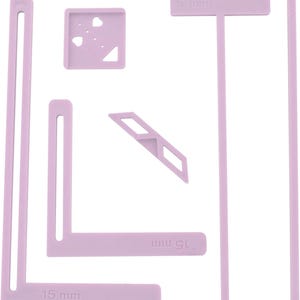 May include: Set of five pink plastic tools for creating precise corners and angles in craft projects. The tools include a 15 mm L-shaped ruler, a 5 mm T-shaped ruler, a 45 mm ruler, a 45-degree angle guide, and a square with a small hole.