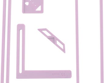 May include: Set of five pink plastic tools for creating precise corners and angles in craft projects. The tools include a 15 mm L-shaped ruler, a 5 mm T-shaped ruler, a 45 mm ruler, a 45-degree angle guide, and a square with a small hole.