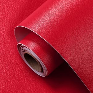 May include: A roll of red faux leather contact paper. The paper has a textured surface that resembles leather.