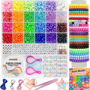 May include: A colorful kit for making friendship bracelets with beads, elastic string, and tools. The kit includes a variety of beads, including letters, smiley faces, and hearts. The kit also includes a spool of elastic string, a pair of tweezers, and a pair of clasps. The kit is packaged in a clear plastic container.