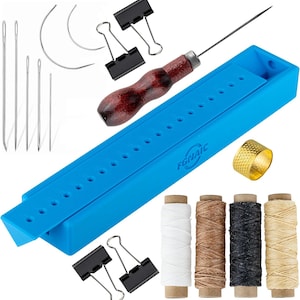 May include: A blue leather craft tool kit containing a selection of tools, including needles, awls, thread, and a thimble. The kit also features a small wooden-handled awl and two metal clips.