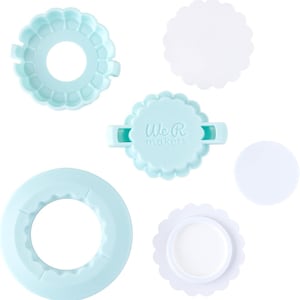 May include: A set of light blue plastic cookie cutters with scalloped edges. The cutters are in the shape of a circle, a ring, and a flower. The set also includes three white plastic discs. The packaging includes the text "We R Makers".