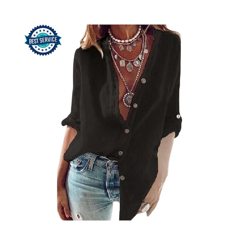 May include: A black button-down shirt with rolled-up sleeves. The shirt has a V-neck and is partially unbuttoned. The model is wearing light blue jeans and multiple layered necklaces. A blue and white "Best Service" badge is in the upper left corner.