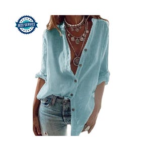 May include: A light blue button-down shirt with long sleeves, rolled up at the elbows. The shirt is paired with light-wash denim jeans. A multi-layered necklace is visible. The image also includes a "Best Service" badge.