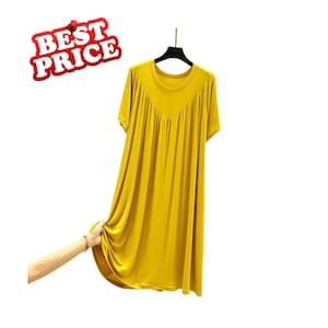 May include: A mustard yellow short-sleeved dress featuring a round neckline and a V-shaped pleated bodice detail. The garment hangs from a black hanger and includes a red graphic element in the upper left corner with the text BEST PRICE.