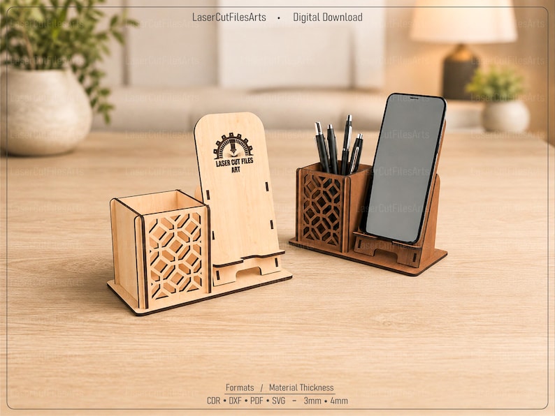 May include: Two laser-cut wooden desk organizers featuring a pen holder with a geometric lattice pattern and an integrated smartphone stand. One organizer is light wood, the other is dark wood. The light wood piece displays the text Laser Cut Files Art.